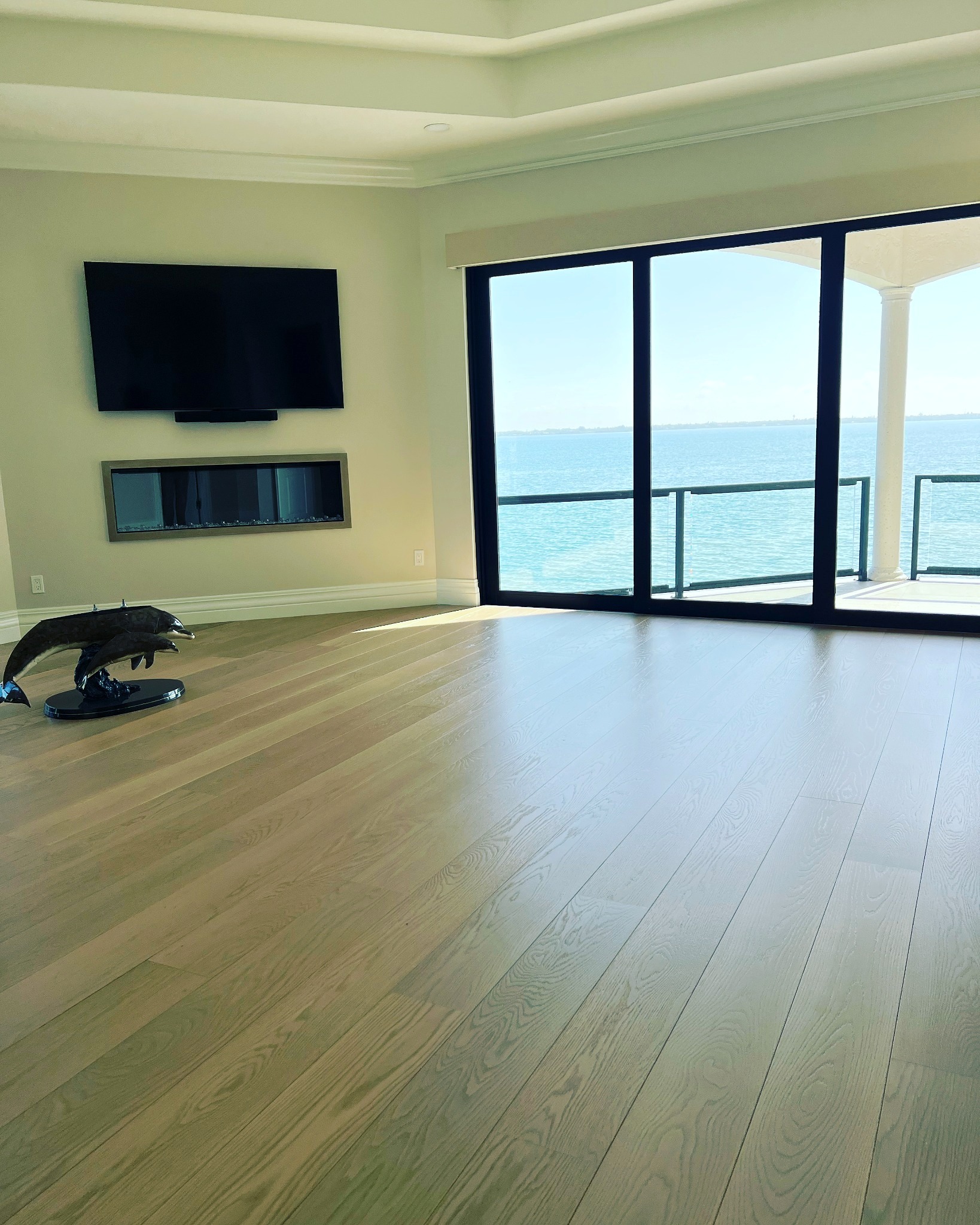 Bright completed interior with finished wood flooring